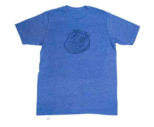 Blue unisex t-shirt featuring a quahog graphic and 'Shuck Yeah' text, laid flat with a relaxed coastal style by Coral Anchor Apparel.