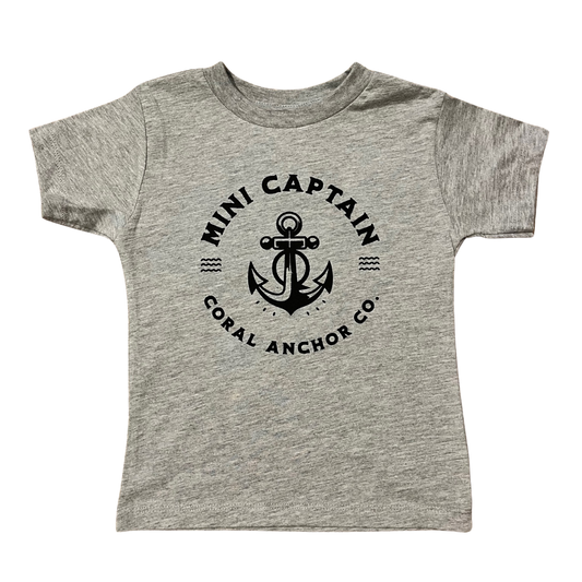 Heather grey youth t-shirt with black anchor and “Mini Captain – Coral Anchor Co.” graphic, laid flat on a white background