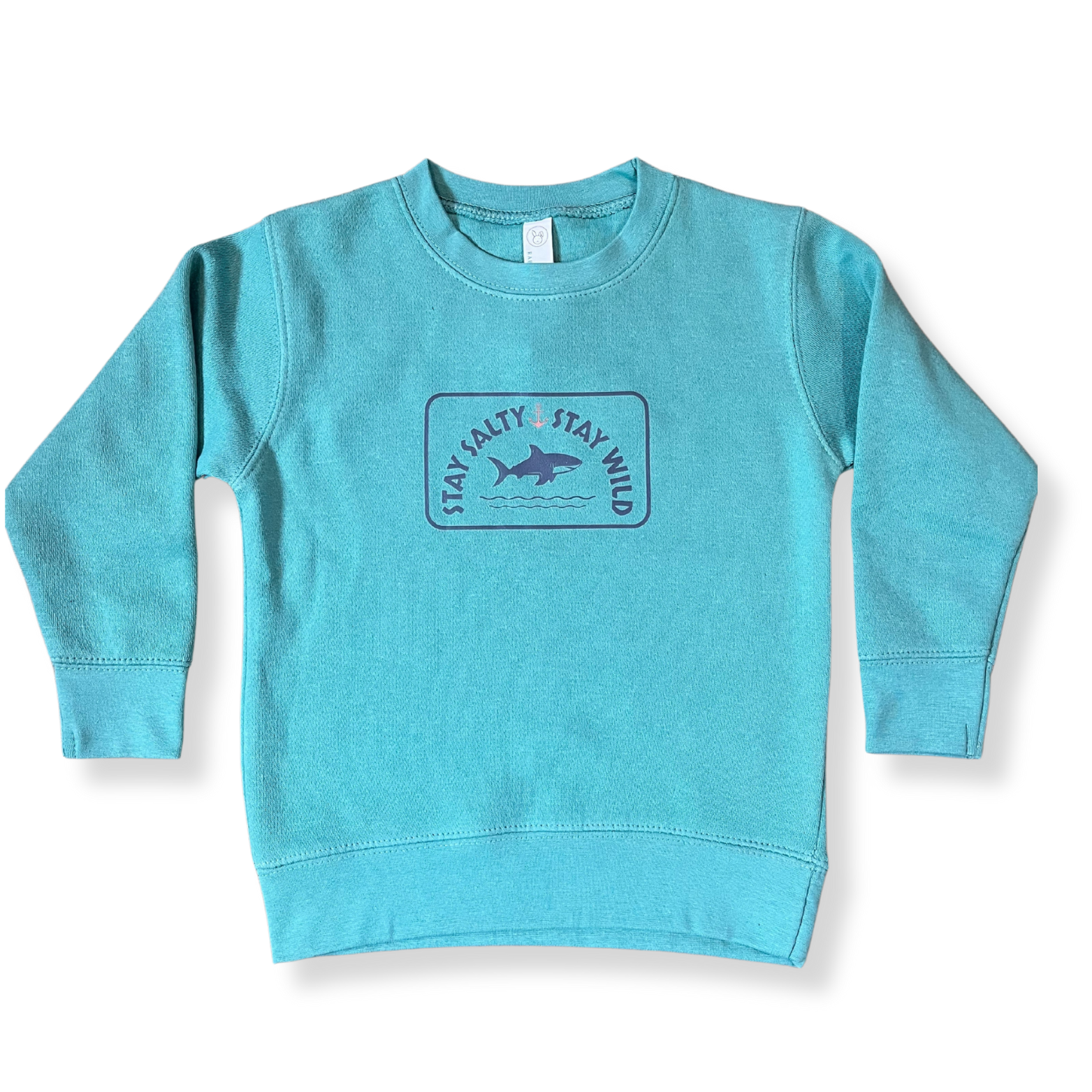 Layflat view of Coral Anchor's toddler crewneck sweatshirt in saltwater blue with shark graphic and "Stay Salty, Stay Wild" text