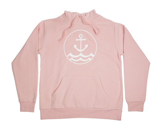 Flat lay of faded pink unisex hoodie with circular anchor and wave logo on front, part of Coral Anchor Apparel's coastal collection.