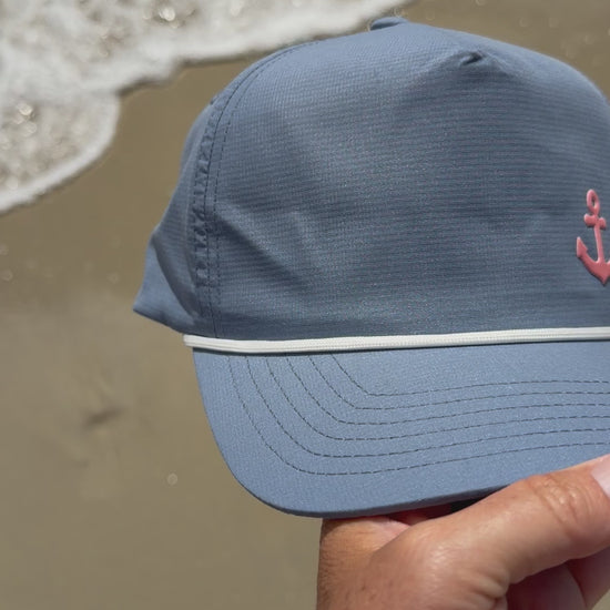 coral anchor hat at the beach