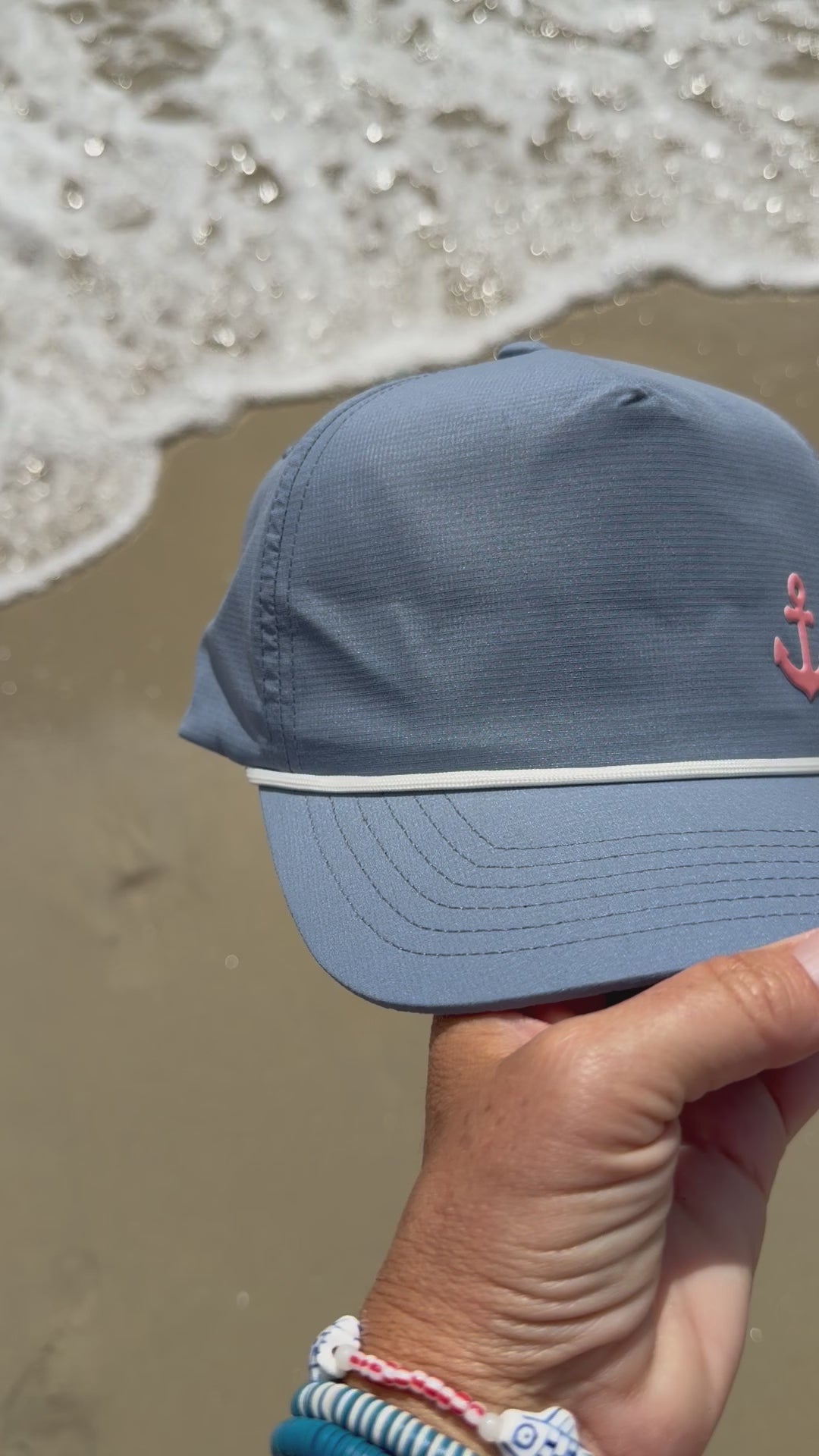 coral anchor hat at the beach